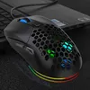 A black gaming mouse with RGB lighting is placed on a dark surface next to a laptop. Produktbild-Vorschau