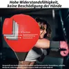 A woman is punching a red punching bag. Produktbild-Vorschau