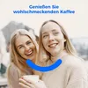 Two young women smiling and holding a cup of coffee. Anteprima dell’immagine prodotto