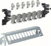 A collection of electrical components, including mounting brackets and modular units, arranged on a white background. Náhled obrázku produktu
