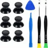 A collection of black thumbsticks, a blue plastic tool, and three screwdrivers are laid out on a white background. Produktbild-Vorschau