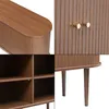 A collage of four close-up images of a wooden sideboard with fluted doors and brass knobs, showing different angles and details. Náhled obrázku produktu