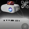 A mini projector with a smartphone on top, showing connectivity icons in the background. Voir les images du produit