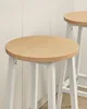 Close-up of two wooden bar stools with white metal legs. Náhled obrázku produktu