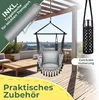 A hanging chair set up on a wooden deck with a table and chairs in the background. Produktbild-Vorschau