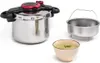 A pressure cooker, a metal insert, and a bowl of soup are arranged on a white background. Podgląd zdjęcia produktu