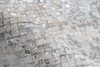 A close-up view of a textured surface made of small, square tiles. Produktbild-Vorschau