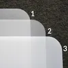 A close-up view of three layered transparent or translucent mats, numbered 1, 2, and 3, on a dark carpeted surface. The mats appear to be protective floor coverings. Anteprima dell’immagine prodotto
