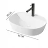 A white ceramic oval basin with a black faucet, with dimensions indicated. Anteprima dell’immagine prodotto