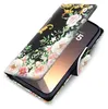 A floral patterned flip case for a smartphone is shown open, revealing the phone screen. Produktbild-Vorschau
