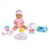 A baby doll with accessories laid out around it. Produktbild-Vorschau