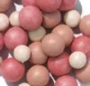A close-up view of many small, round blush pearls in various shades of pink and beige. Produktbild-Vorschau