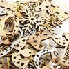 A close-up view of various wooden Christmas ornaments, including snowflakes, trees, and angels, intertwined with gold string. Produktbild-Vorschau