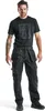 A man wearing work pants and a t-shirt, posing for a product shot. Produktbild-Vorschau