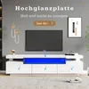 A modern living room setup featuring a TV stand with LED lighting and a television. Produktbild-Vorschau