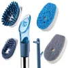 A collection of cleaning brushes and sponges with a dispenser. Anteprima dell’immagine prodotto