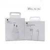 Two white boxes of Apple products, a power adapter and a charging cable, are displayed side-by-side against a white background. Produktbild-Vorschau