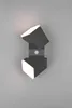 A modern, dark gray wall light with two adjustable cube-shaped lamps, each emitting warm white light. A small, circular motion sensor is visible in the center. Anteprima dell’immagine prodotto