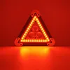 A red triangular warning light with multiple LEDs is shown in the center of the image, casting a red glow on the surface below. Voir les images du produit