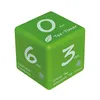 A green cube-shaped tea timer with different time settings and tea types labeled on its faces. Podgląd zdjęcia produktu