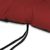 A close-up view of the corner of a red cushion with black ties hanging down. Produktbild-Vorschau