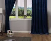 A room with a window, curtains, and a basket of magazines. Produktbild-Vorschau
