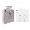 Two white boxes of Apple charging accessories are shown side-by-side. Produktbild-Vorschau