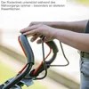 A person's hands are shown gripping the handles of a lawnmower. Produktbild-Vorschau