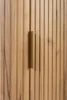A close-up view of a wooden cabinet door with a brass handle. Podgląd zdjęcia produktu