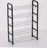 A black five-tier shoe rack with metal shelves, presented against a white and light gray background. Produktbild-Vorschau