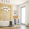 A modern bathroom with a freestanding bathtub, wooden wall paneling, and a laundry basket. Anteprima dell’immagine prodotto