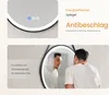 A collage of a round LED mirror with touch controls and a man looking into a mirror in a bathroom. Anteprima dell’immagine prodotto