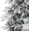 A close-up view of flocked artificial Christmas tree branches. Produktbild-Vorschau
