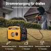 A person is using a hedge trimmer powered by a generator in a garden. Produktbild-Vorschau