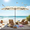 A beach scene with lounge chairs, an umbrella, and the ocean in the background. Anteprima dell’immagine prodotto