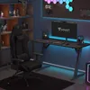 A gaming setup with a chair, desk, computer, and decorative lights. Produktbild-Vorschau