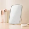 A makeup mirror with LED lighting and two cosmetic bottles. Podgląd zdjęcia produktu