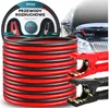 A coiled set of red and black jumper cables is shown in the foreground, with a car engine bay and jumper cable clamps attached to a car battery in the background. Podgląd zdjęcia produktu