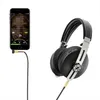 A smartphone connected to a pair of headphones. Produktbild-Vorschau