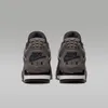 The back view of a pair of Nike Air Jordan 4 Retro sneakers. Náhled obrázku produktu