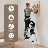 A man is standing on a step ladder, hanging a picture on the wall. The image also includes a sidebar with icons and text describing product features. Produktbild-Vorschau