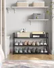 A shoe rack with shoes on it, placed against a white wall. Náhled obrázku produktu