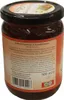 A glass jar of sauce with a label. Anteprima dell’immagine prodotto