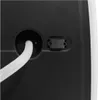 Close-up of the back of a device with a white hose connected to a circular port and a black connector piece next to it. Produktbild-Vorschau