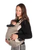 A woman is holding a baby in a baby carrier. Náhľad obrázku produktu