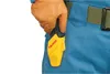 A close-up shot of a gloved hand holding a yellow holster attached to a blue garment. Anteprima dell’immagine prodotto