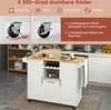 A white kitchen island with a wooden countertop is shown in a kitchen setting. The image also includes close-ups of the wheels and text highlighting product features. Voir les images du produit