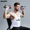 A man is performing dumbbell exercises while sitting on a bench. Produktbild-Vorschau