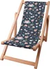 A wooden folding deck chair with a dark blue fabric seat featuring a floral and bug pattern. Voir les images du produit