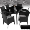 A black rattan dining set with a glass-top table and six chairs, set against a textured background with water droplets. Náhled obrázku produktu